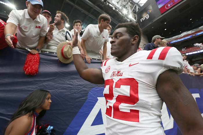 Mississippi Rebels defensive end Tariqious Tisdale (22) shakes hands with fans after defeating the Texas Tech Red Raiders in the at NRG Stadium. Mandatory Credit: Thomas B. Shea-USA TODAY Sports